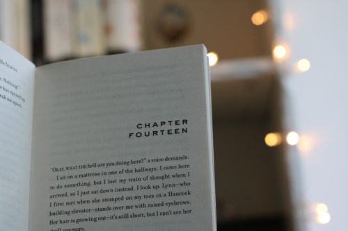 Close up-of a book page that reads "Chapter Fourteen" at the top.
