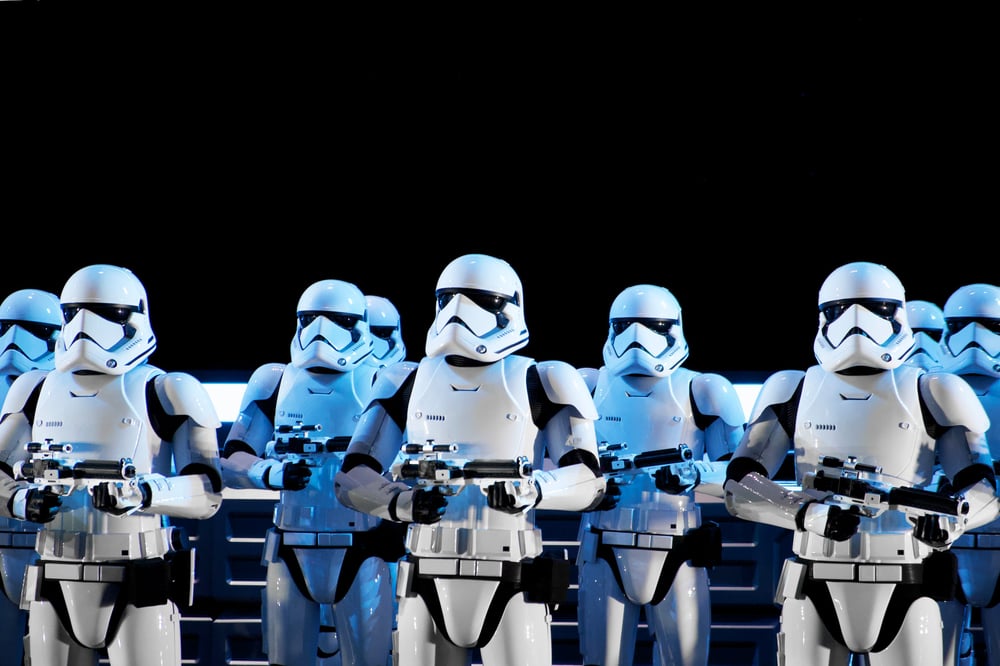 Several stormtroopers stand in a line.