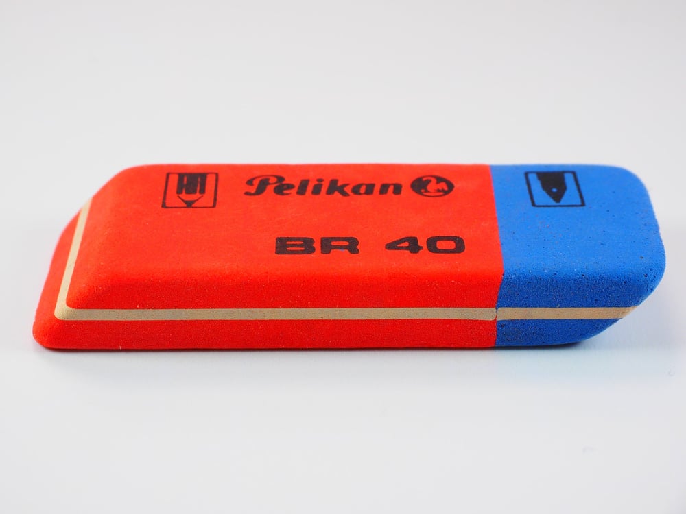 A red and blue stick eraser.