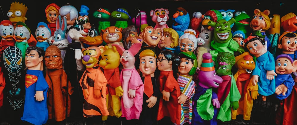 Dozens of puppets of famous characters like Winnie the Pooh, Superman, Shrek, and more.