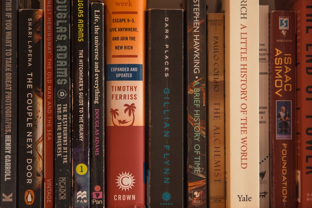 Close-up of popular traditionally published books on a shelf.