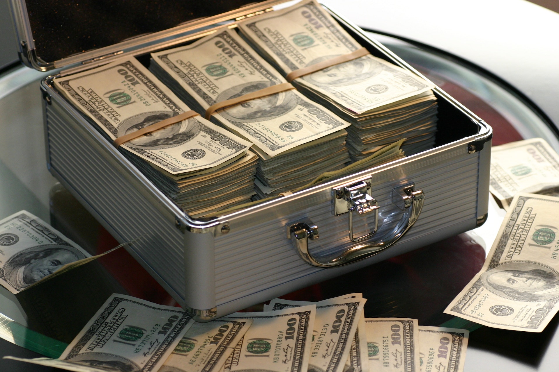 A metal case full of hundred dollar bills.