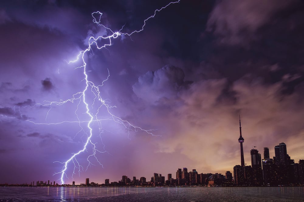 Lightning strikes the far edge of the Toronto skyline.