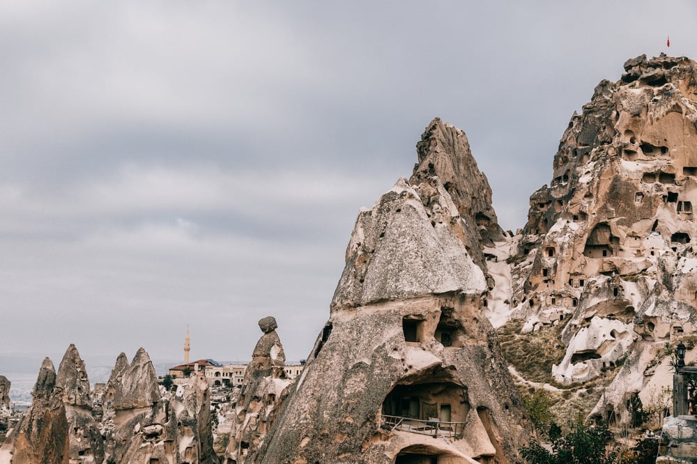 Ancient rock homes carved into canyon walls in Cappadocia.