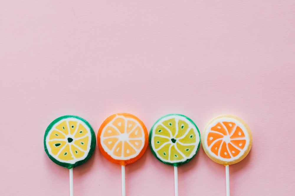 Four colorful lollipops in a row.