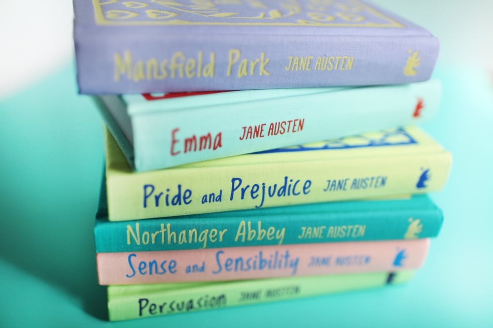 A colorful stack of Jane Austen novels.