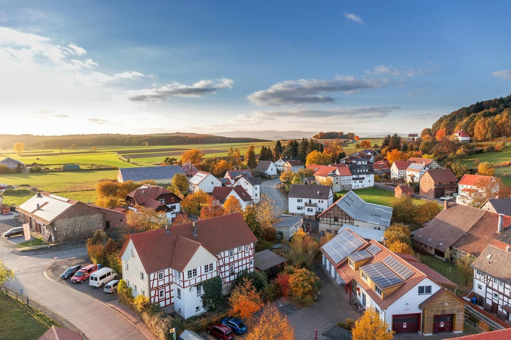 An aerial view of a country village in fall colors.