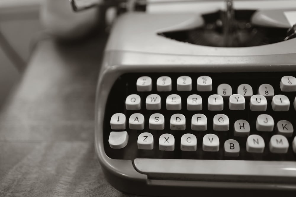 A gray vintage typewriter.