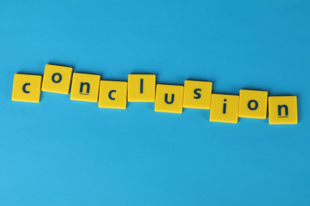 The word "conclusion" spelled out in yellow letter tiles on a blue background.