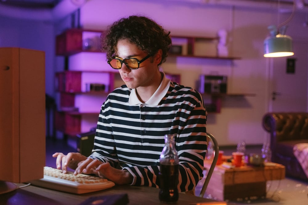 A person types on their computer.