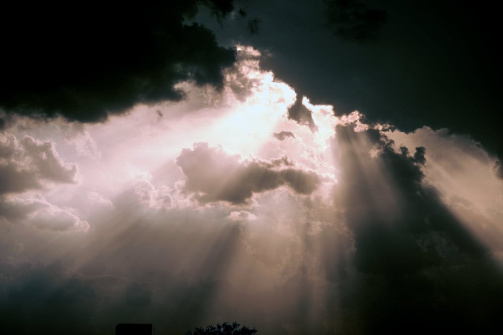 Light streaming through dark clouds.
