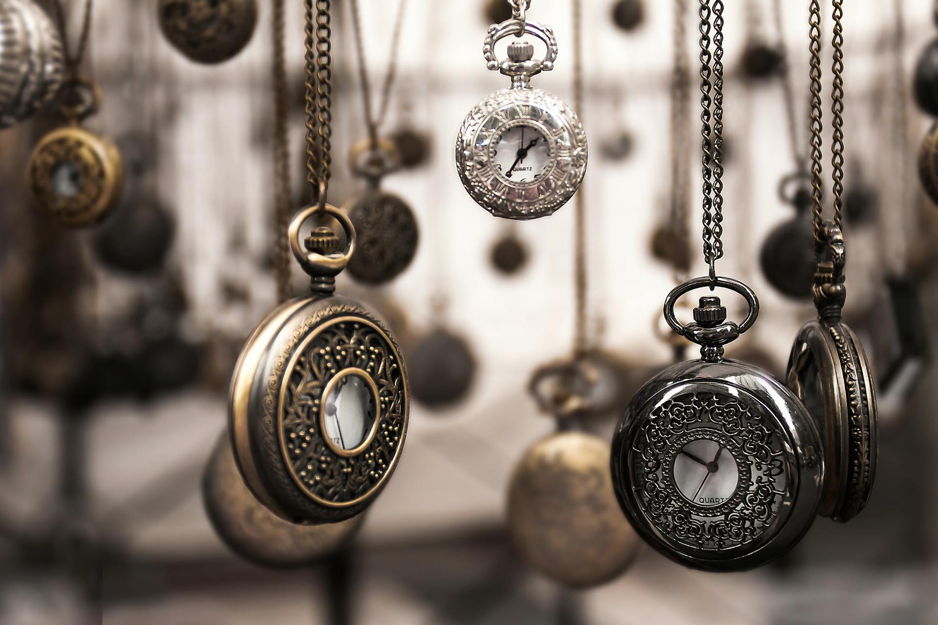 Dozens of hanging antique pocketwatches.