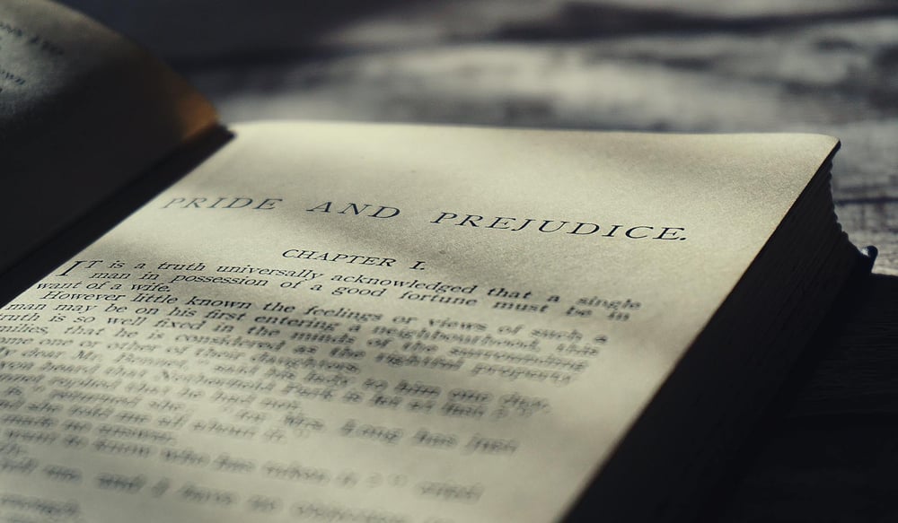 A copy of Pride and Prejudice open to Chapter One.