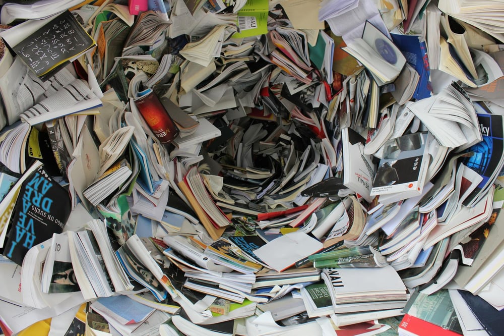 A hole made of warped paperback books.