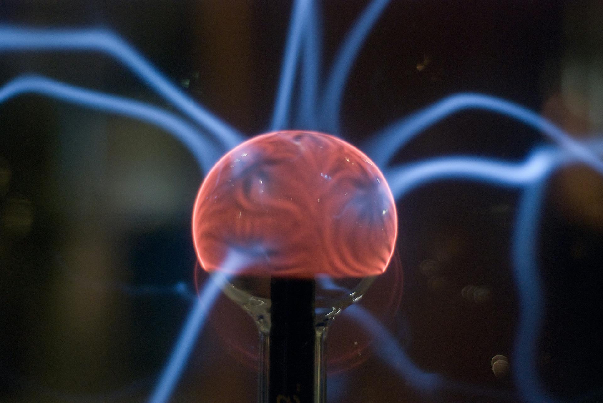 Electricity shooting out of a glowing orange orb.