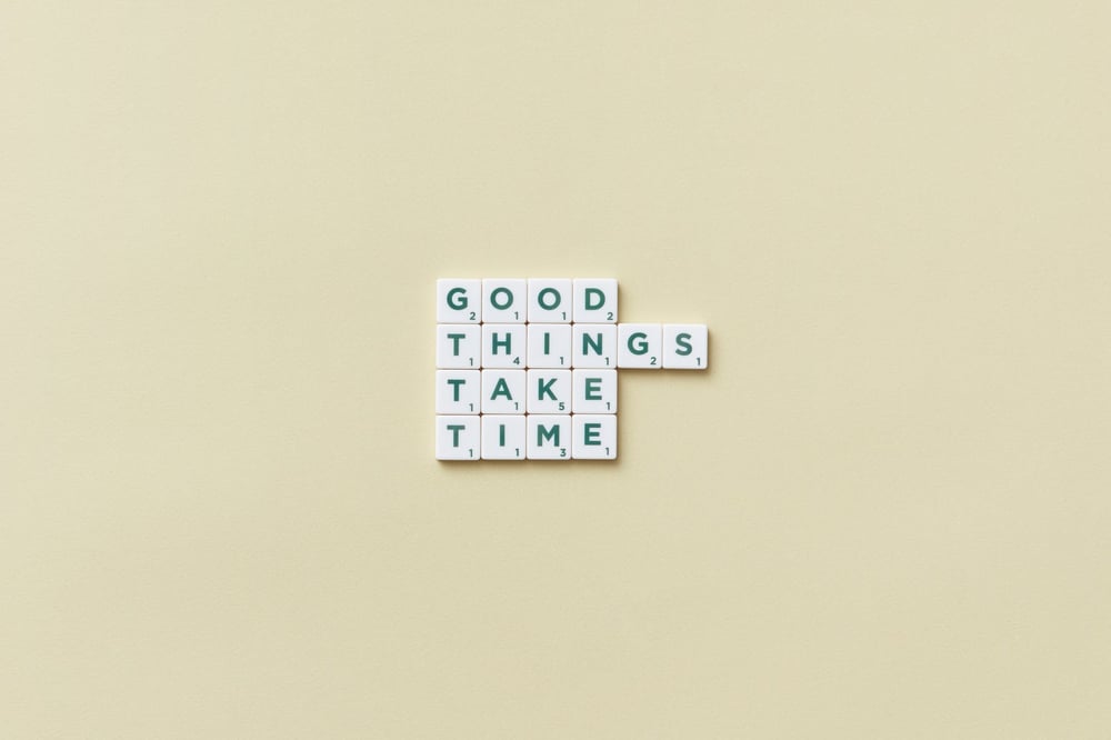 White Scrabble tiles reading,