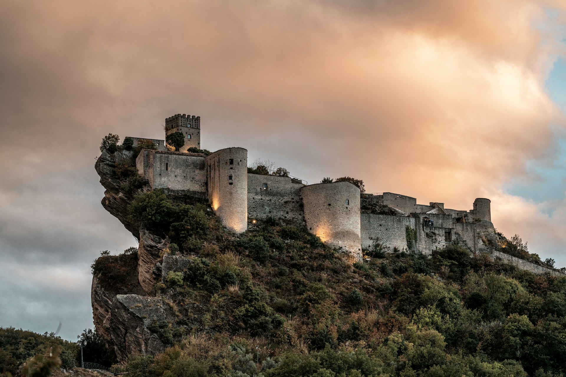 A long Italian castle on a narrow hilltop.