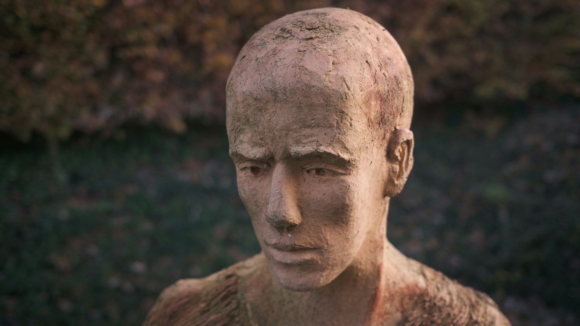 A complete sculpture of a human head, more detailed than the one before.